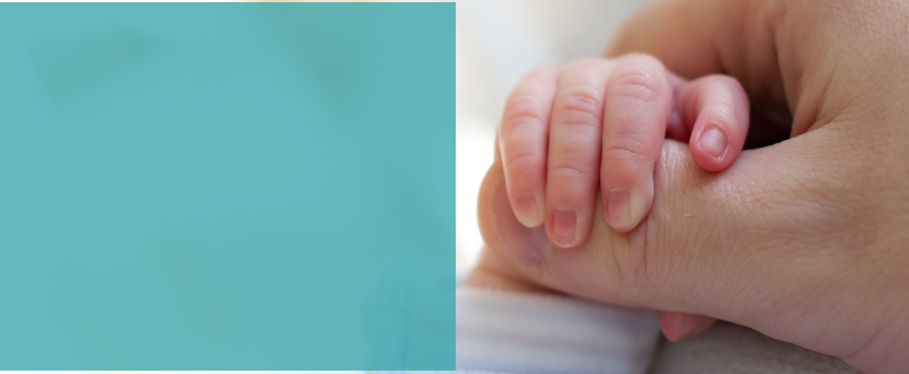 Newborn baby touching his mother hand
